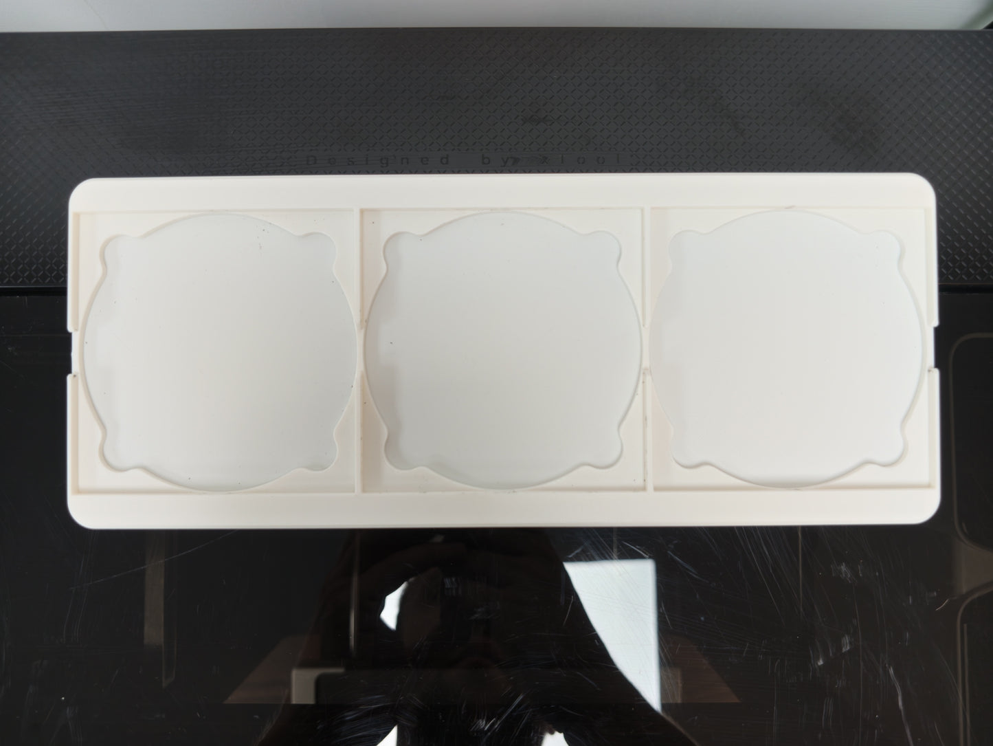 Finished custom printed slate coasters made using the L3D jig and xTool O1 Omni