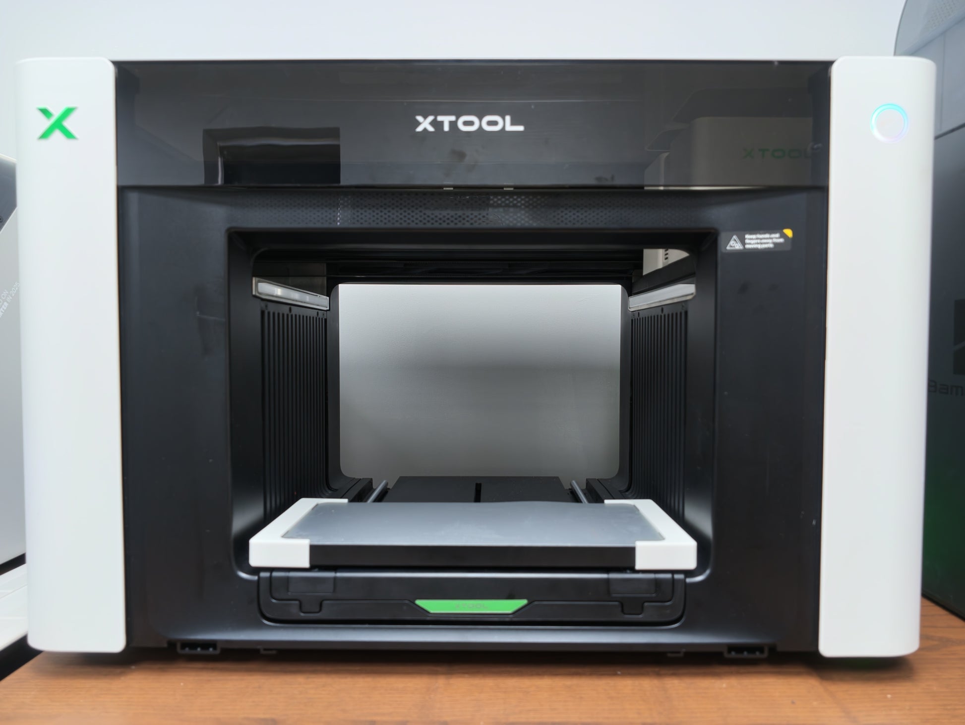 Omni Bracket System quick-swap jig mounting rails installed on the xTool O1 Omni UV printer bed