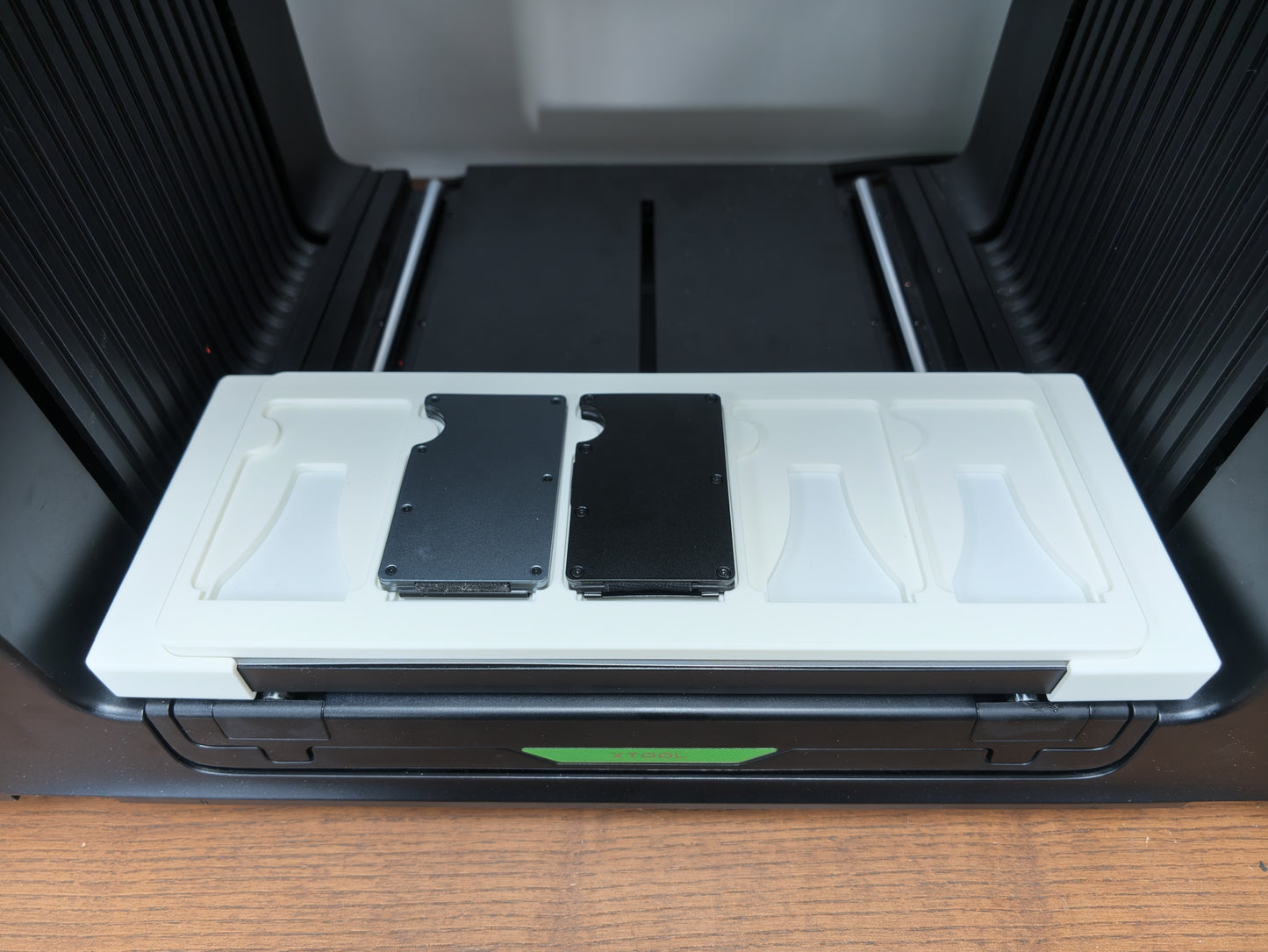 Metal Wallet Jig with wallet blanks loaded on the xTool O1 Omni