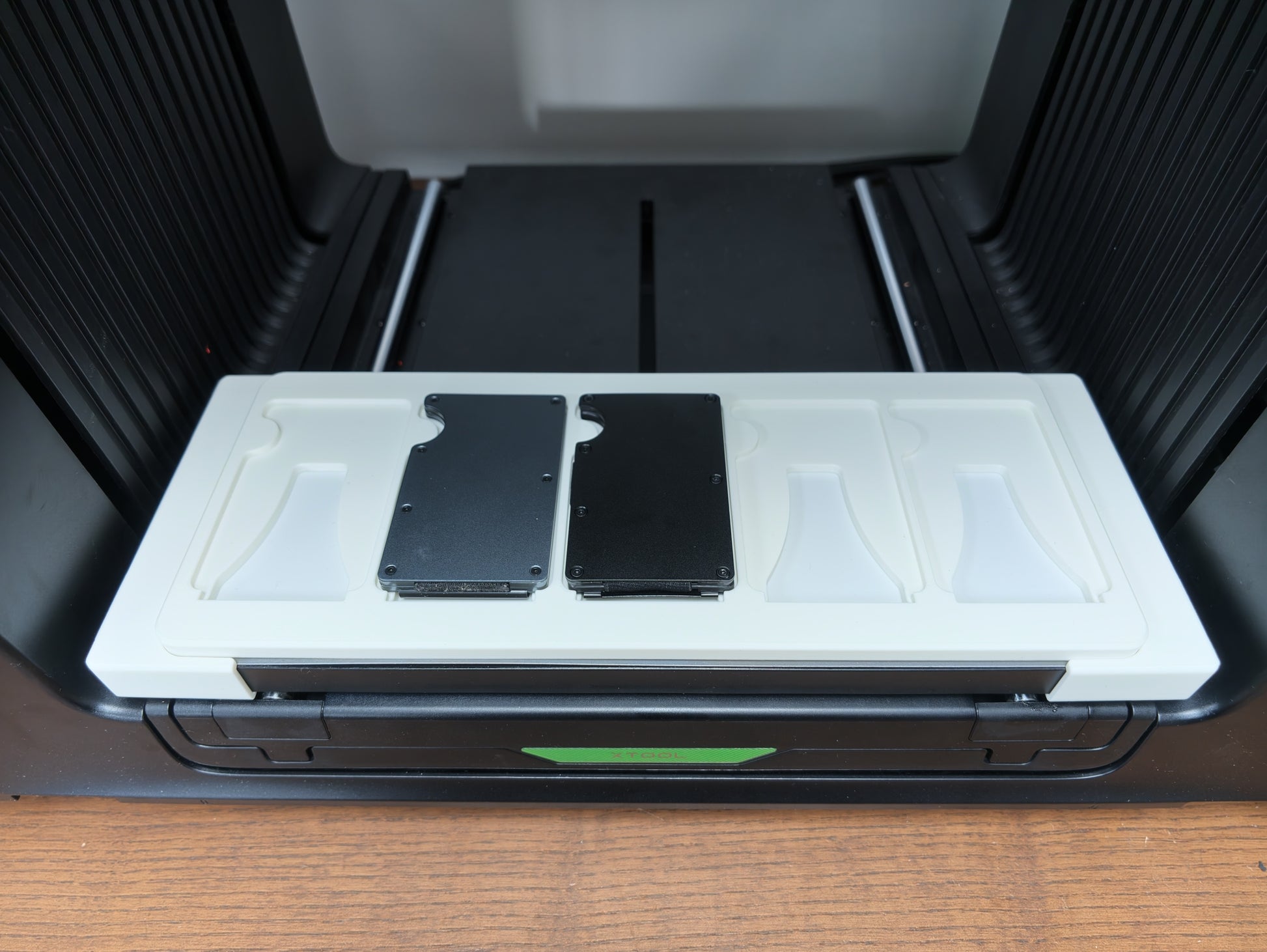 Metal Wallet Jig with wallet blanks loaded on the xTool O1 Omni