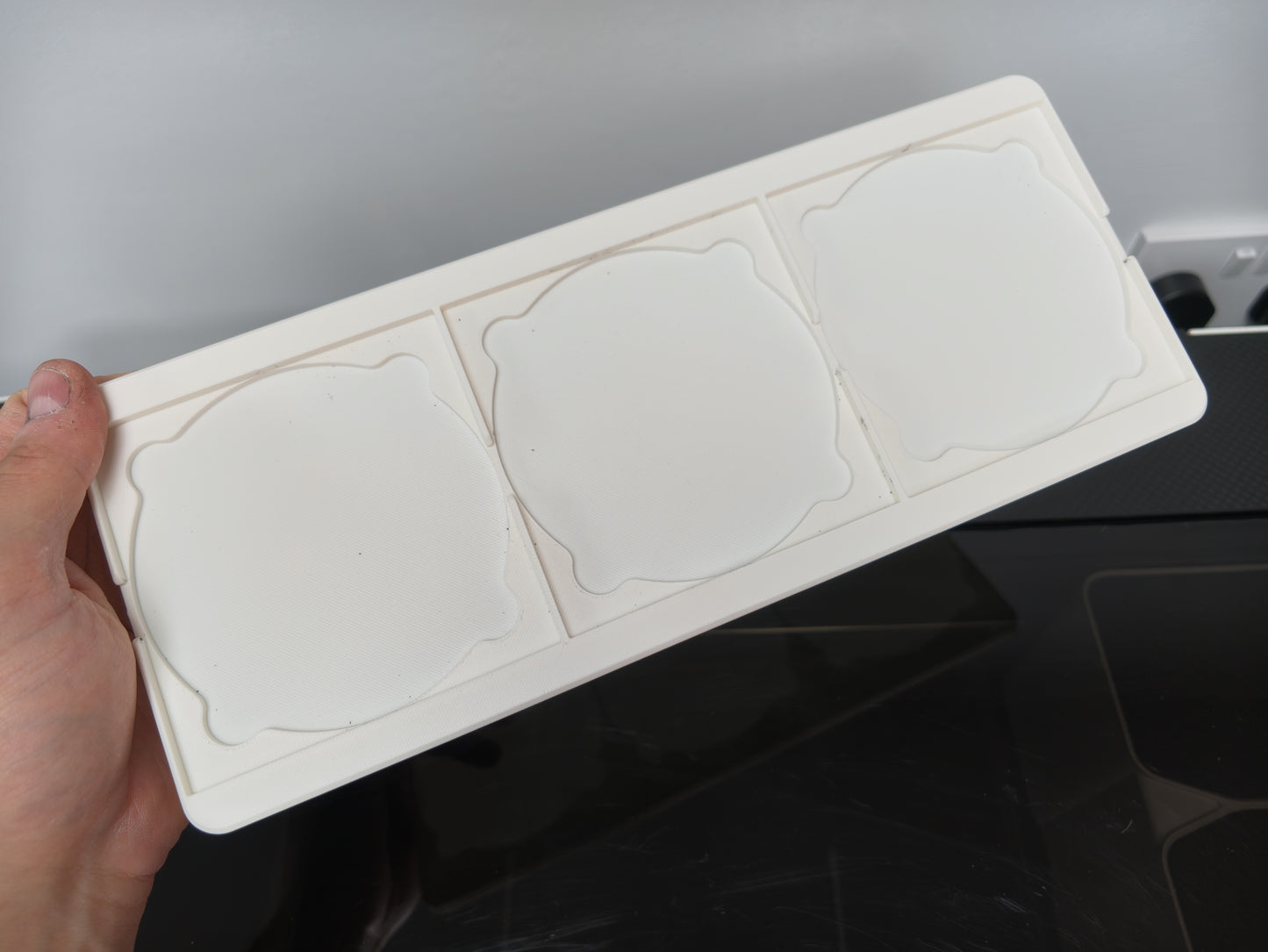 Close up of coaster pockets on the L3D slate coaster jig for the xTool O1 Omni