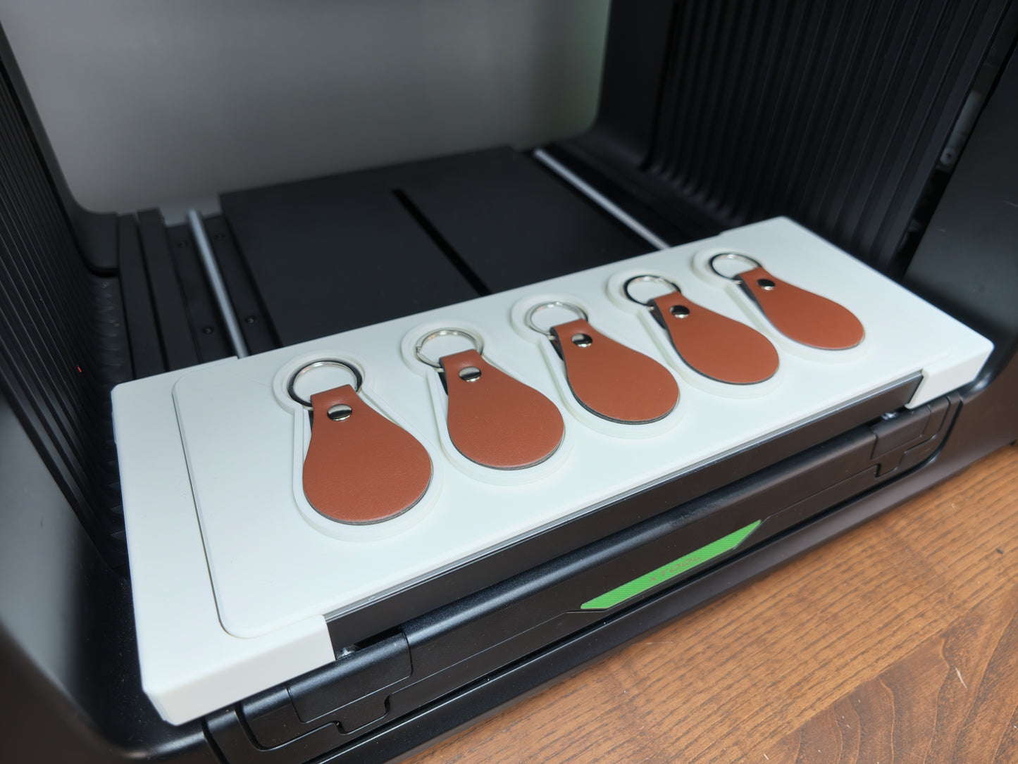Close-up of leather keychain jig alignment pockets for the xTool O1 Omni
