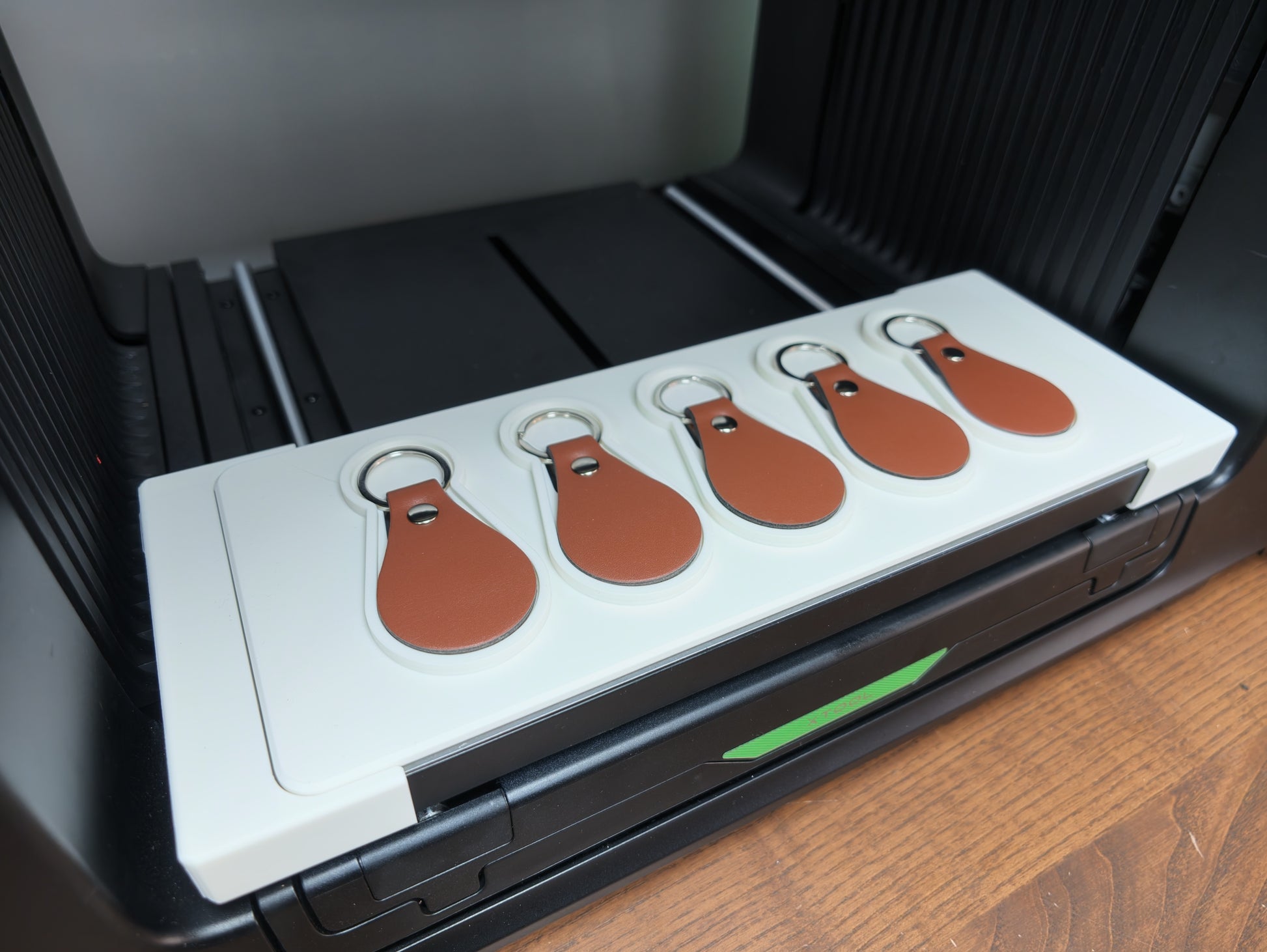 Close-up of leather keychain jig alignment pockets for the xTool O1 Omni