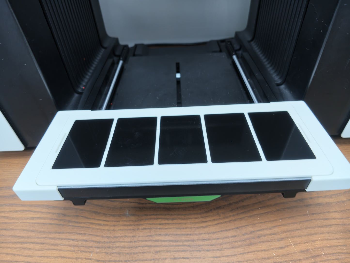 Matte white PLA metal business card jig colour matched to the xTool O1 Omni