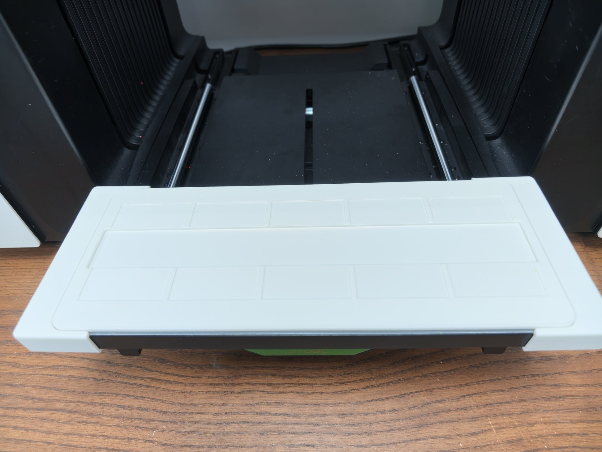 Metal business card jig dropped into the Omni Bracket System on the xTool O1 Omni