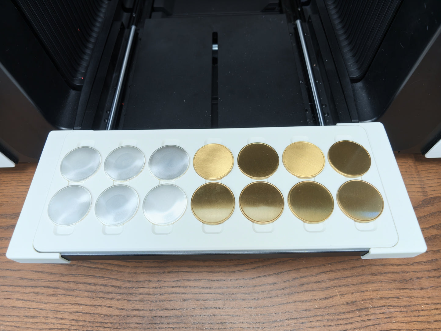 Close-up of 40mm coin blanks seated in the jig