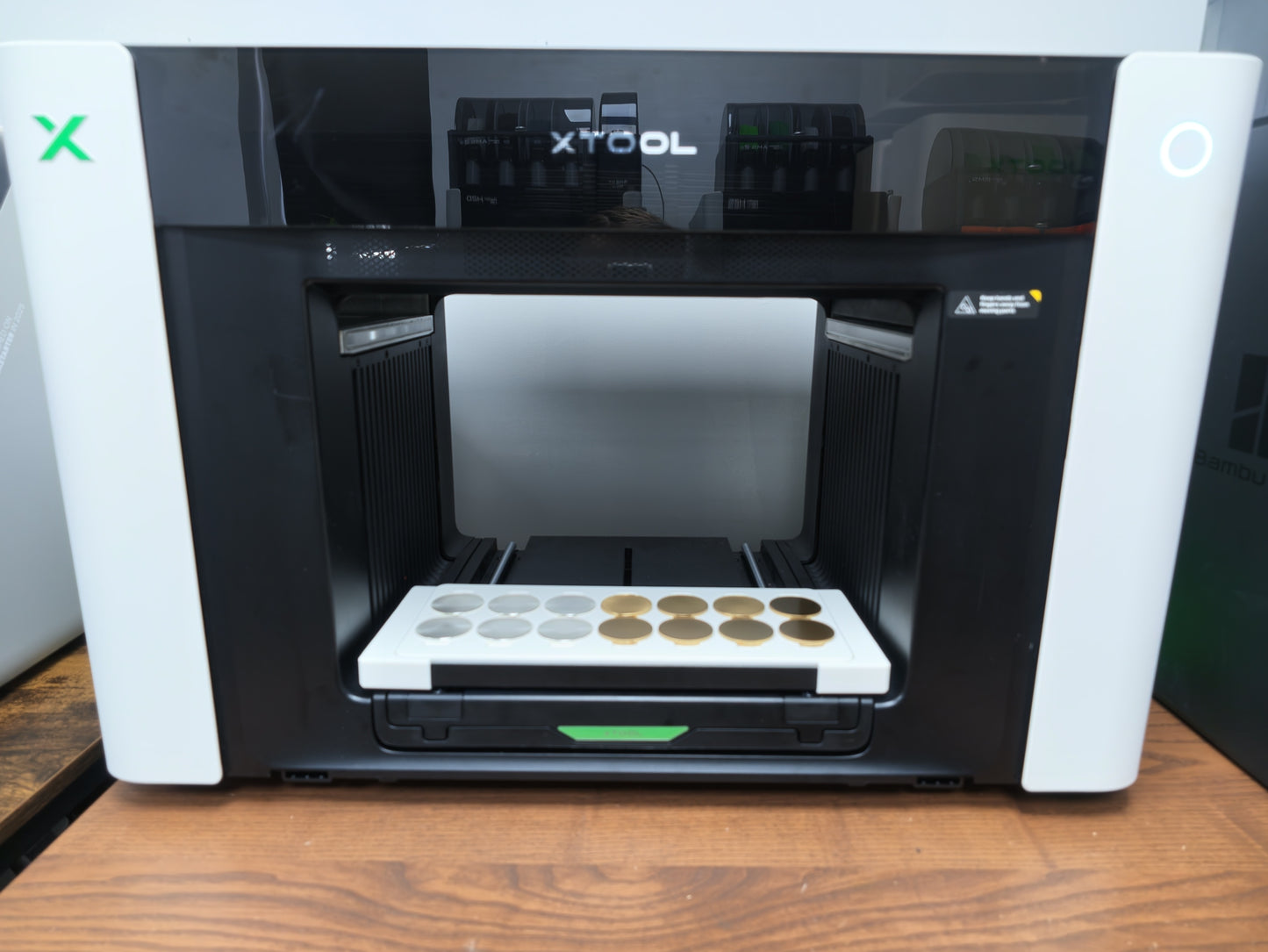 xTool O1 Omni UV printer with challenge coin jig installed