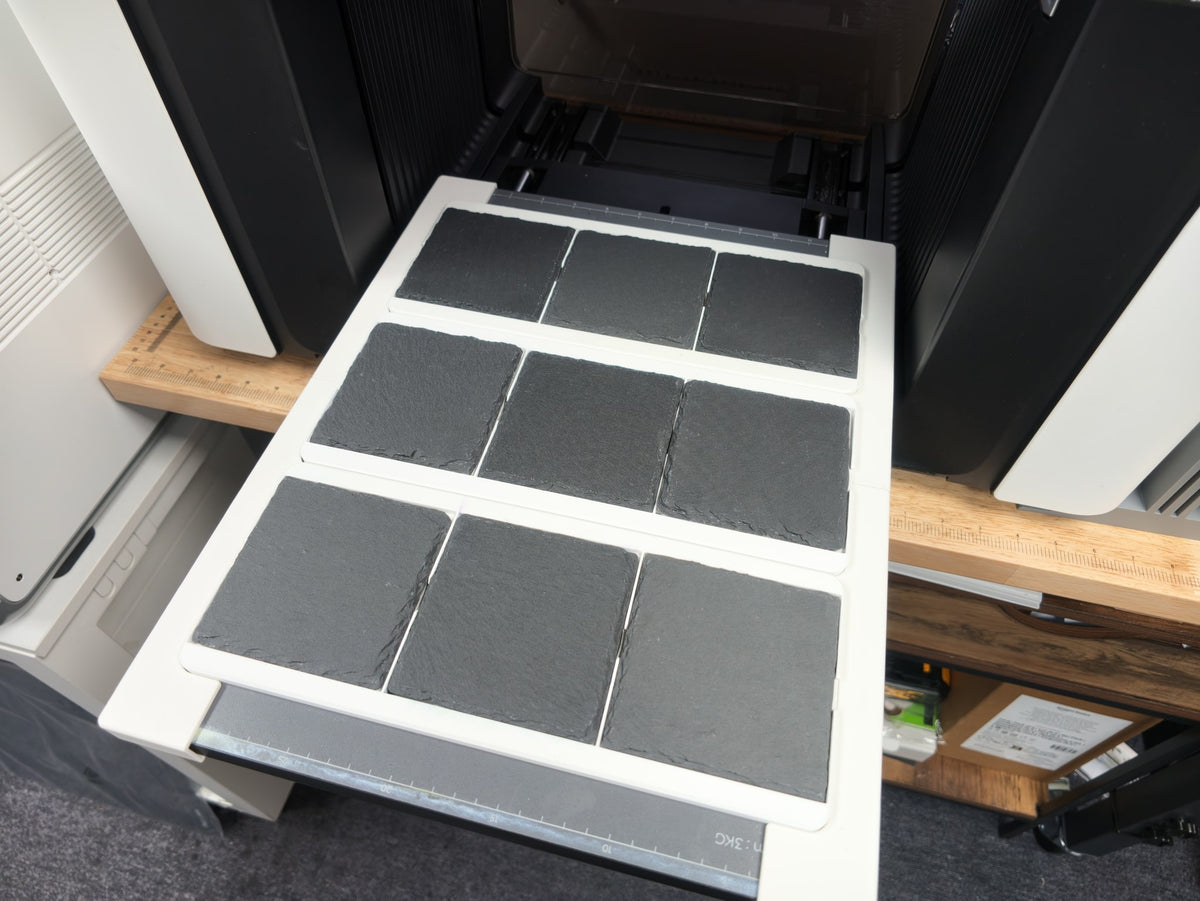 Omni Bracket System XL with three L3D slate coaster jigs loaded with nine slate coasters