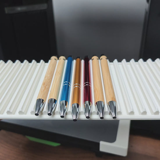 Video of the pen jig in use on the xTool O1 Omni UV printer