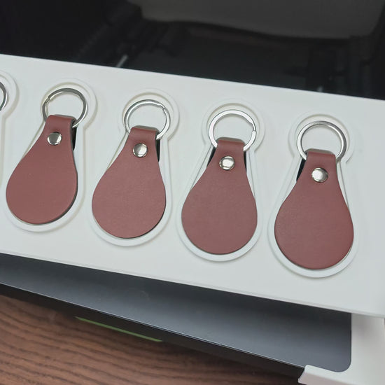 Leather keychain jig in action on the xTool O1 Omni UV printer