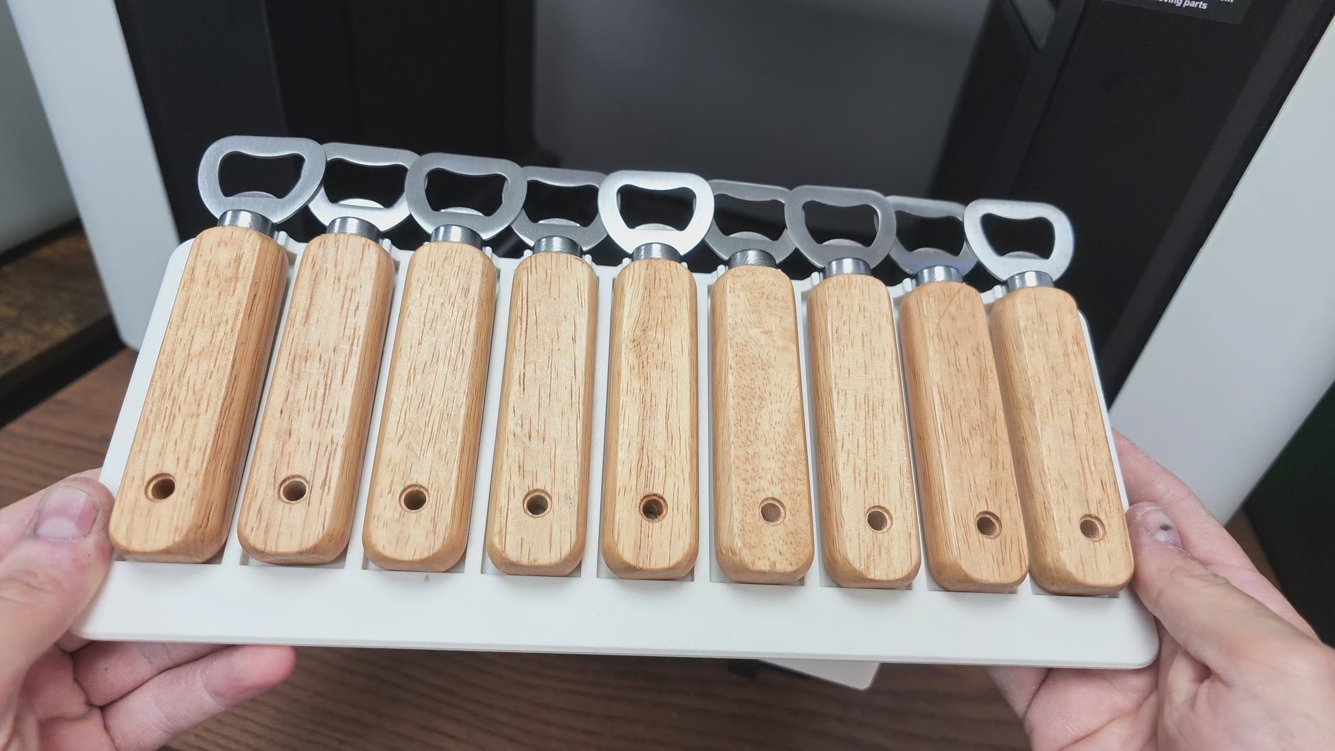 Video of the wooden bottle opener jig in use on the xTool O1 Omni UV printer