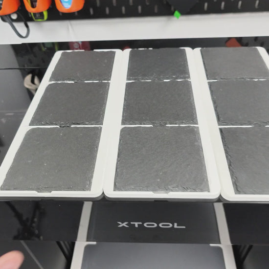 Video loading three L3D slate coaster jigs into the Omni Bracket System XL on the xTool O1 Omni