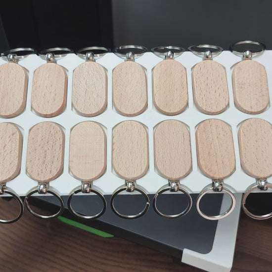 Oval wooden keychain jig in action on the xTool O1 Omni UV printer