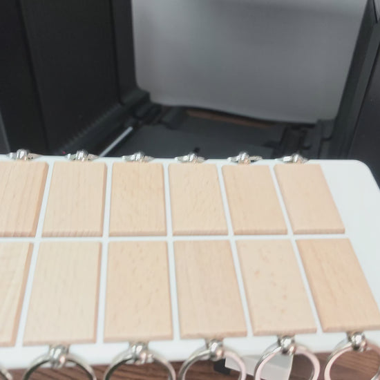 Video of the rectangular wooden keychain jig in use on the xTool O1 Omni UV printer
