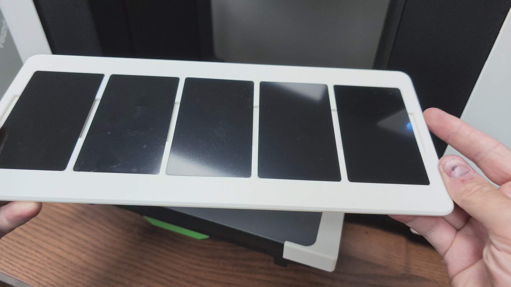 Video of the metal business card jig batch printing on the xTool O1 Omni UV printer