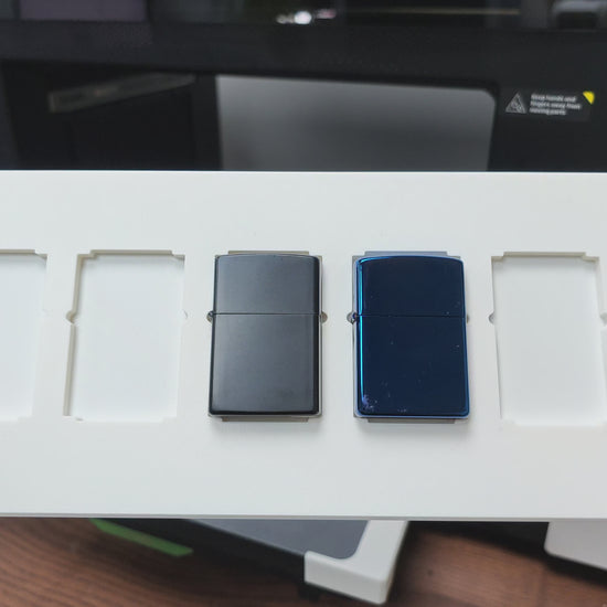 Video of the flip lighter jig batch printing Zippo-style lighters on the xTool O1 Omni