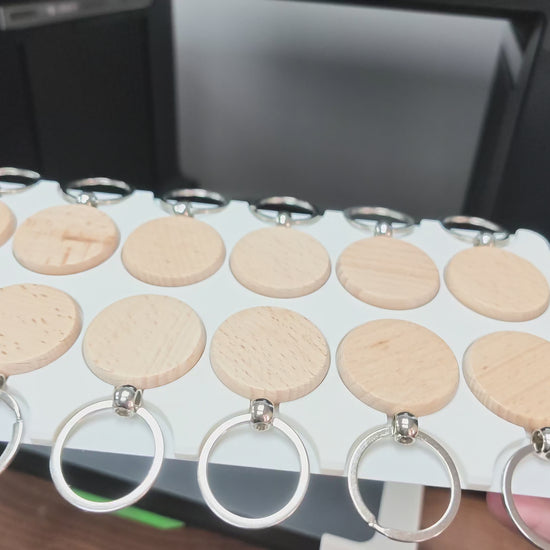 Video of the round wooden keychain jig in use on the xTool O1 Omni UV printer